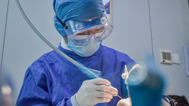 person in blue long sleeve shirt wearing blue goggles