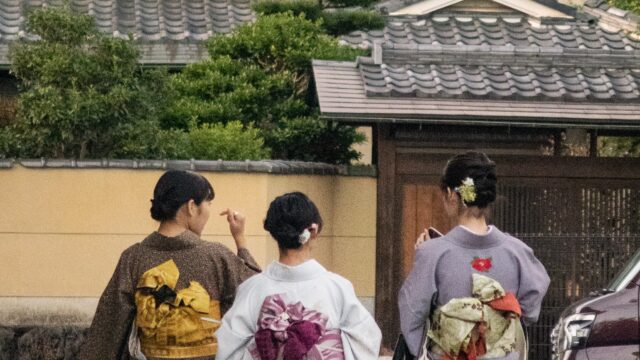 three women walking on paved raod